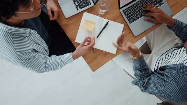 Above, students and men with laptop, notebook and brainstorming for tasks, studying and ideas. Education, scholarship and people with computer, university and planning with research and collaboration