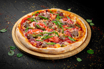 Juicy appetizing pizza on a dark black background. Hot melted cheese, golden crust, and rich toppings styled in a minimal yet delicious presentation.