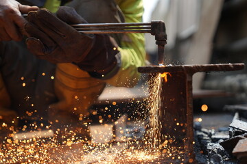 Iron welders are working industrially with sparks