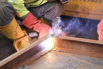 Iron welders are working industrially with sparks