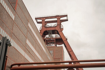Low angle view of Zollverein Coal Mine Industrial Complex tower on an overcast day, Essen, Germany