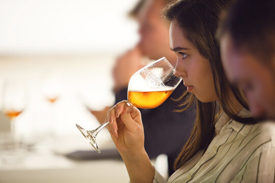 Woman Smells Beer Tasting it Being in Alcoholic Beverages Degustate Training.