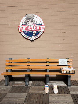 A bench in front of the Bubba Gump restaurant is San Francisco in USA