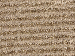 Close-up abstract background of beige modern carpet.