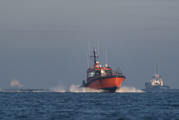 Fototapeta premium MARITIME TRANSPORT - A pilot boat sails on the sea