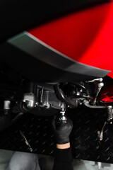Motorcycle crankcase inspection with ratchet wrench ensures performance efficiency. Mechanic...