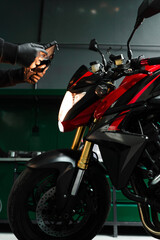 Mechanic performing system diagnostics via tablet. Motorcycle system diagnostic, scanning for...
