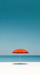 Bright orange beach umbrella on white sand, vibrant blue sky