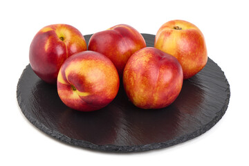 Nectarines on Slate Plate, isolated on white background