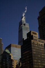 Busy New York streets with skyscrapers and steam define urban life
