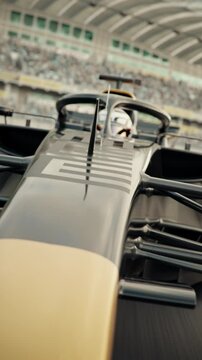 Close front view of a generic formula one race car driving around a curve. Dynamic tracking shot. Multiple race cars. 3D animation rendering. New 2025 black and gold race car design