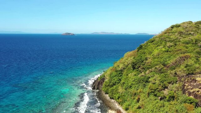 Cliffs of Tokoriki tourism resort island in Fiji Mamanuca islands coral reefs Pacific ocean.
