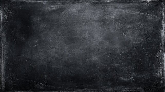 Classic black chalkboard surface with worn texture and chalk dust marks for education.