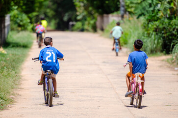 gang of kids riding bicycles © ศิริวุฒิ จารุพันธ์