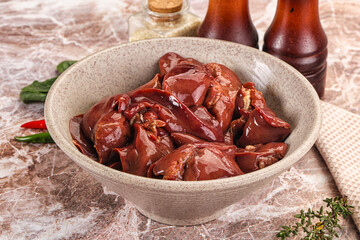Raw uncokked chicken liver in the bowl