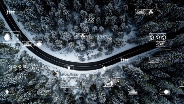Drone perspective over snowy woods and asphalt road, digital network grids and real-time analysis overlays - Powered by Adobe