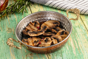 Tasty hot grilled champignon mushrooms
