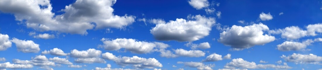 Obraz premium A vast expanse of a clear blue sky dotted with puffy white clouds