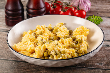 Scrambled egg omelet with green peas