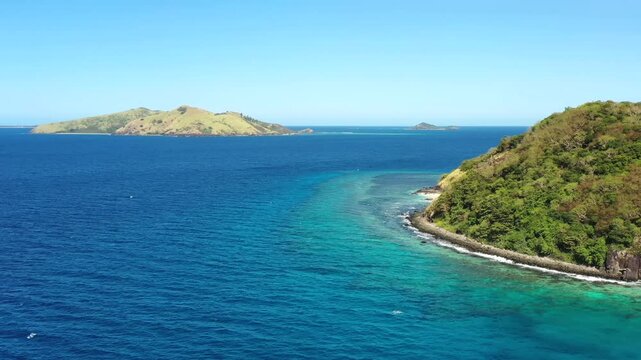 Aerial panorama of tropical Tokoriki island Hideaway beach coral reefs seas in Fiji 4k.
