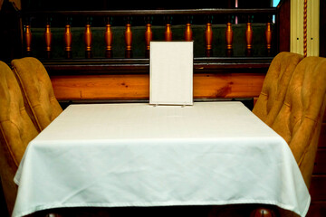 A table in a cafe, ready to receive guests, visitors