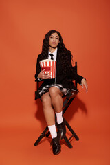Schoolgirl Sipping on sugary soda and snacking on popcorn, feeling happy