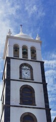 A white bell tower in Tenerife with blue clear sky