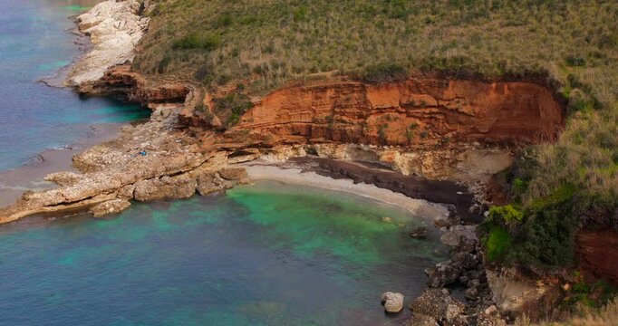 Aerial shot of Cala Bianca in Sicily, Italy, "White cove". Turquoise water.