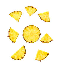Sliced and whole pineapple pieces floating on transparent background