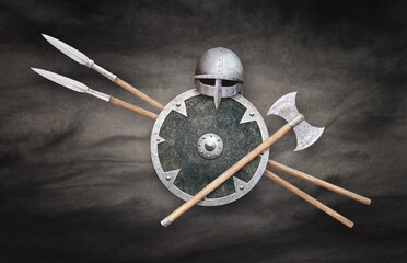 viking helmet axe shield and two spears on grunge background