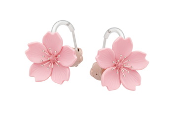 Two hearing aids decorated with pink cherry blossoms against a black background