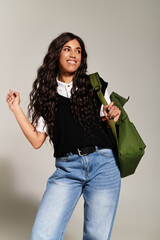 Young student exudes positivity with stylish vibes and a confident pose in casual attire