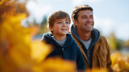 Father and son enjoying autumn fun in the park