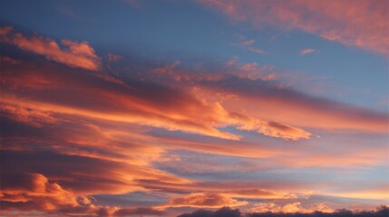 Obraz premium Vibrant Sunset Sky with Colorful Clouds Over Calm Horizon During Evening Time.