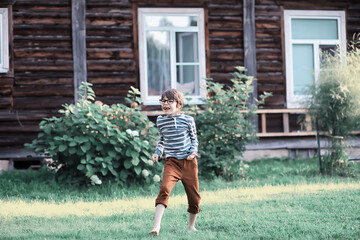 Cute little girl  on the meadow in spring day