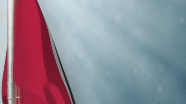 Waving Trinidad and Tobago flag on light blue bokeh background