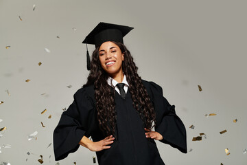 Graduating student celebrating achievement with confetti in a studio setting