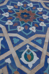 Samarkand , Uzbekistan 20 October, 2024: Guri Amir mausoleum closeup of tile mosaic of a flower