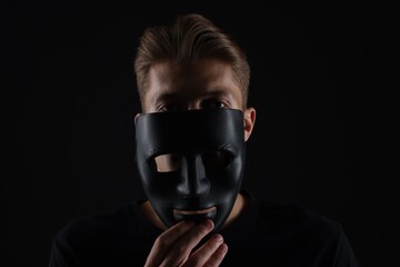 Anonymity. Man with mask on dark background