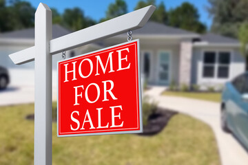 Home For Sale Real Estate Sign and Beautiful New House.