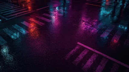 Texture of wet city street at night with neon reflections, urban backg