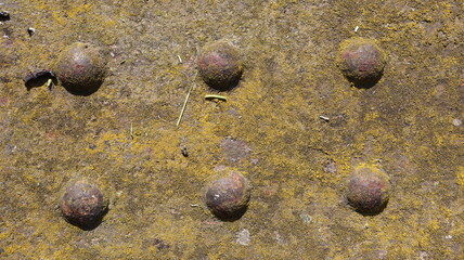 Background close-up rusty sheet metal with protruding rivets