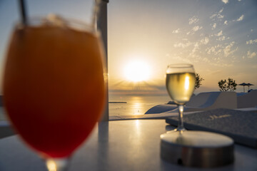 glasses of champagne on the beach in Santorini Greece