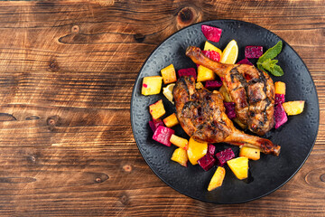 Duck legs marinated in pineapple and slices dragon fruit.