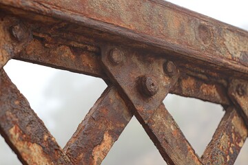 Close-up of rusty metal bridge beams