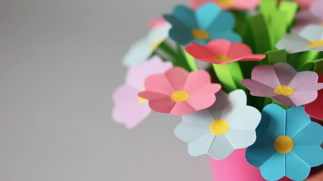 summer paper craft for kids. create art for children bouquet of flowers for mother's day. color blue background