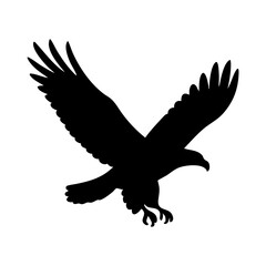 Obraz premium Flying eagle silhouette with spread wings and sharp claws in attack