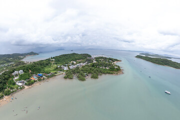 Yacht marina in Phuket, Thailand, located by the sea with scenic views of surrounding mountains....
