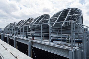 Cooling towers system, Chillers, Induced draft cooling towers on rooftop of building. Heating, ventilation and air conditioning or HVAC on rooftop