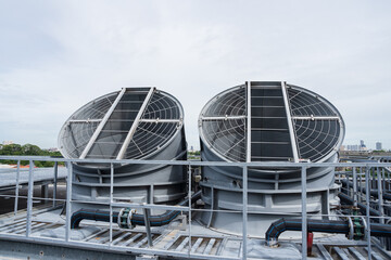 Cooling towers system, Chillers, Induced draft cooling towers on rooftop of building. Heating,...